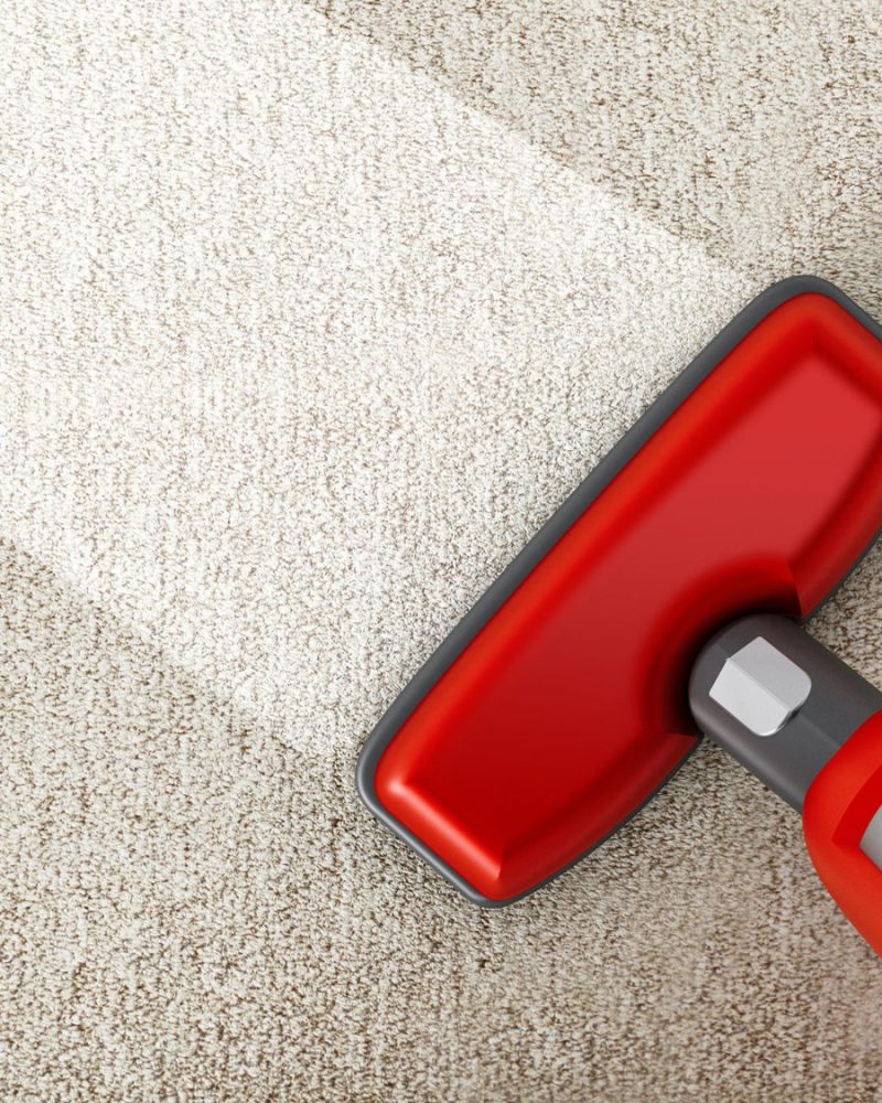 red-vacuum-cleaner-cleaning-carpet